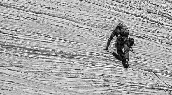 I wore my approach shoes for the route and found that they were sufficient--there were some places where it was a bit scary having to make moves in larger shoes, but despite the distance between many of the bolts, there was always a bolt where a hard move demanded protection--so while it WAS in reality runout, it didn't feel like it. (Photo: Chris Mahoney)