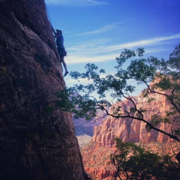 Aaron climbing Ashtar Command in Zion National Park.